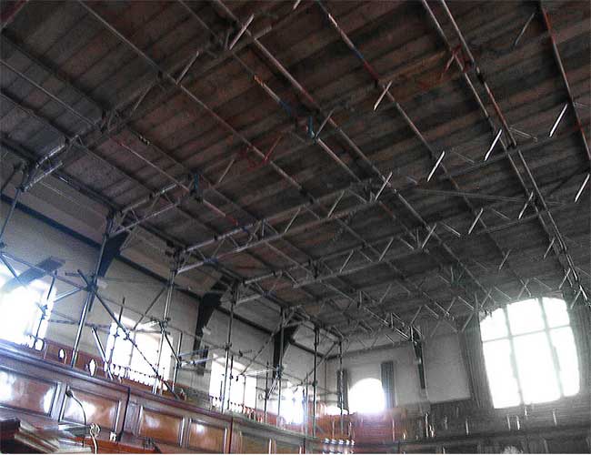 Scaffold to enable work on church roof.