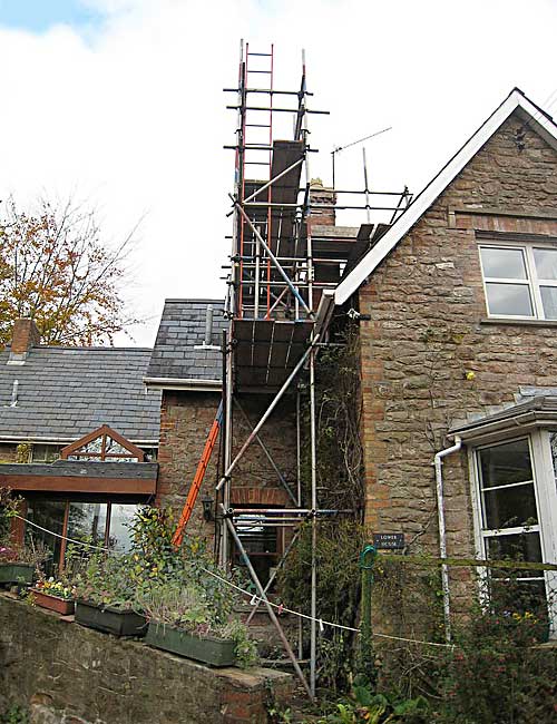 Roof and chimney access of residential building.